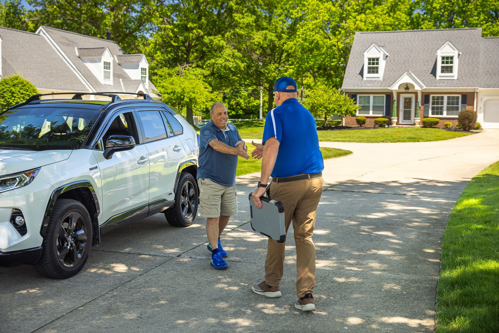 HOA account manager and customer shaking hands