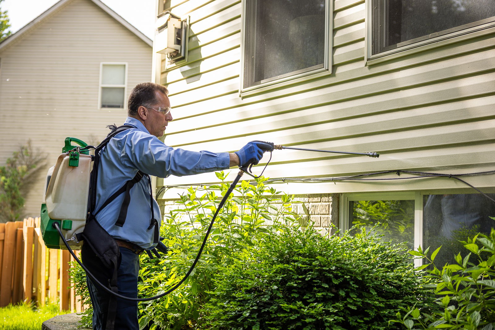 pest control crew spraying house 5