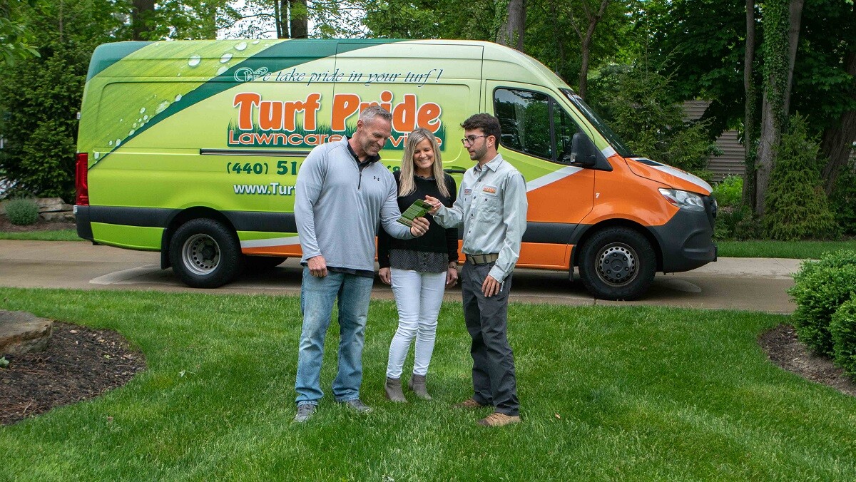 lawn-tech-talking-with-couple-pamphlet