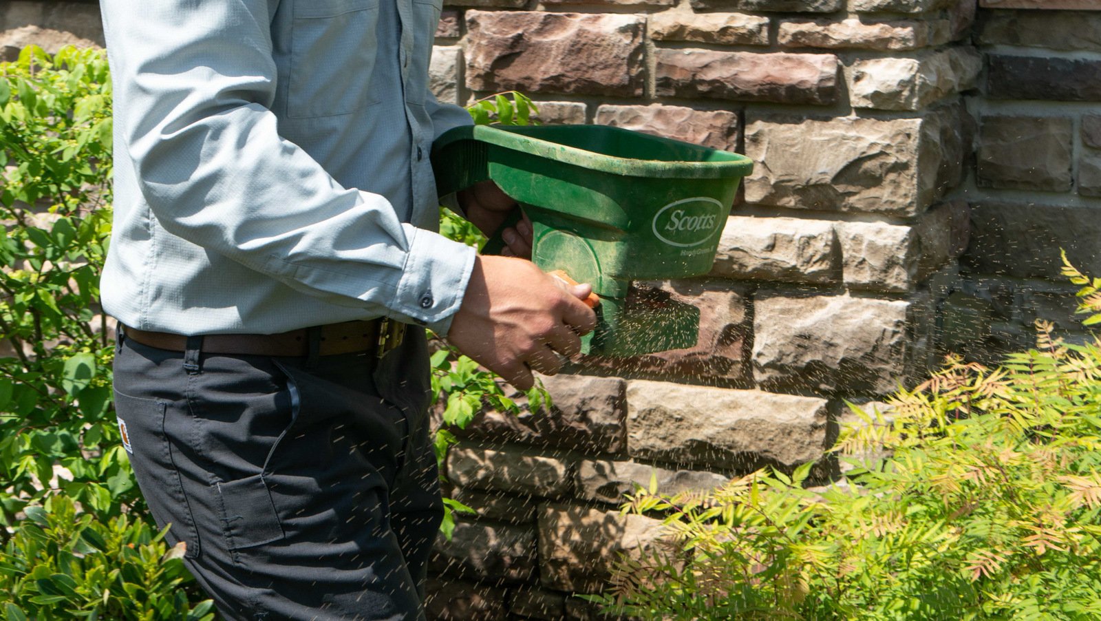 technician-hand-machine-fertilizer