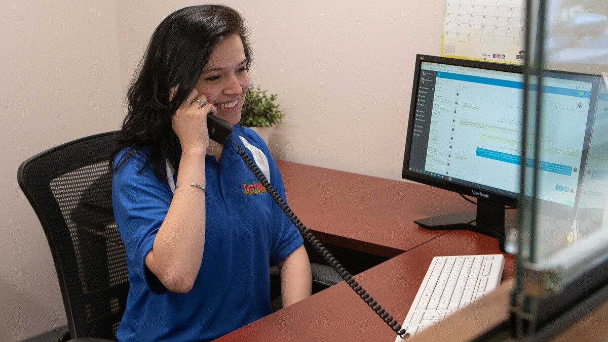 turf-pride-receptionist-on-phone