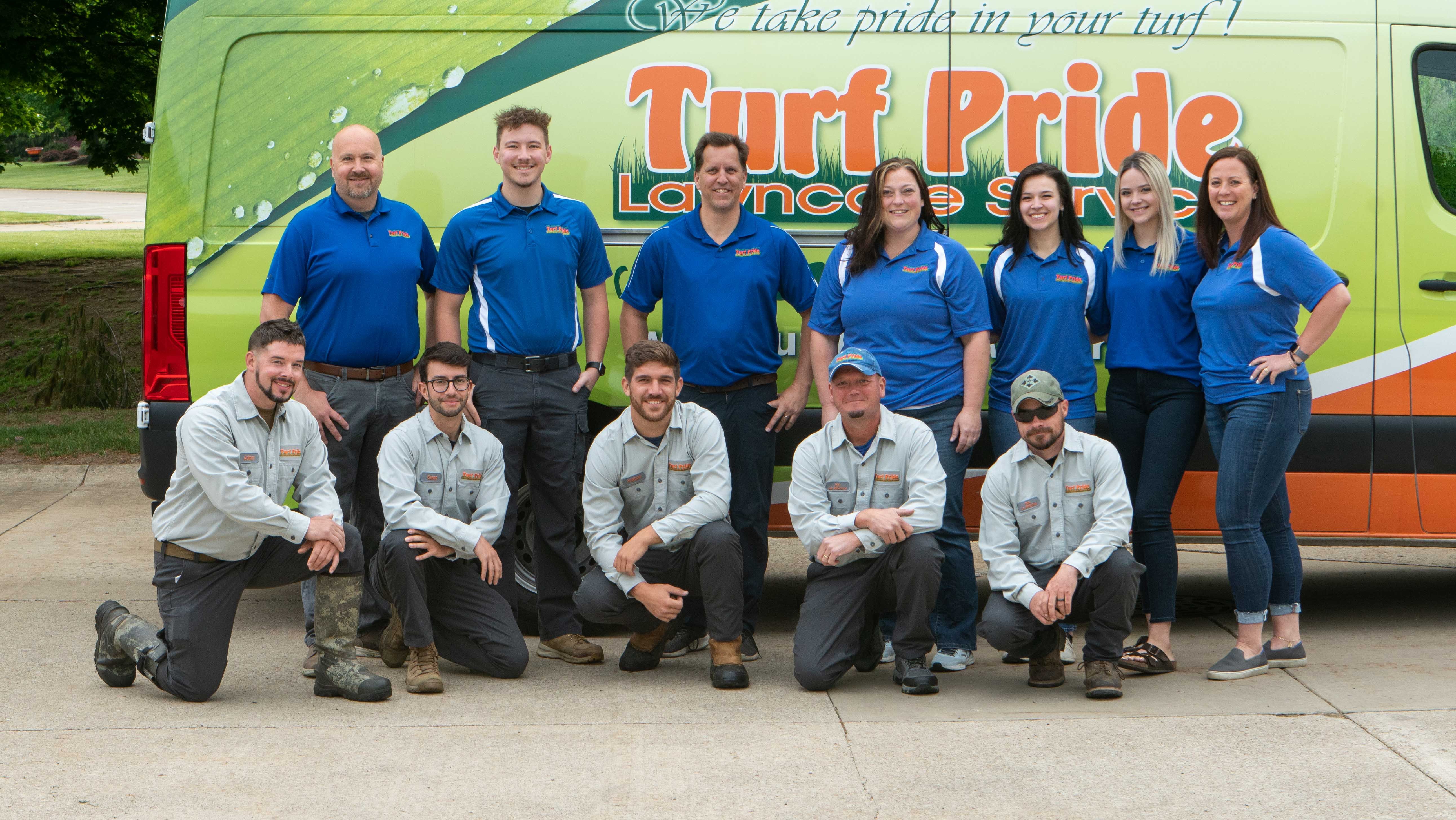Turf pride team photo in front of truck