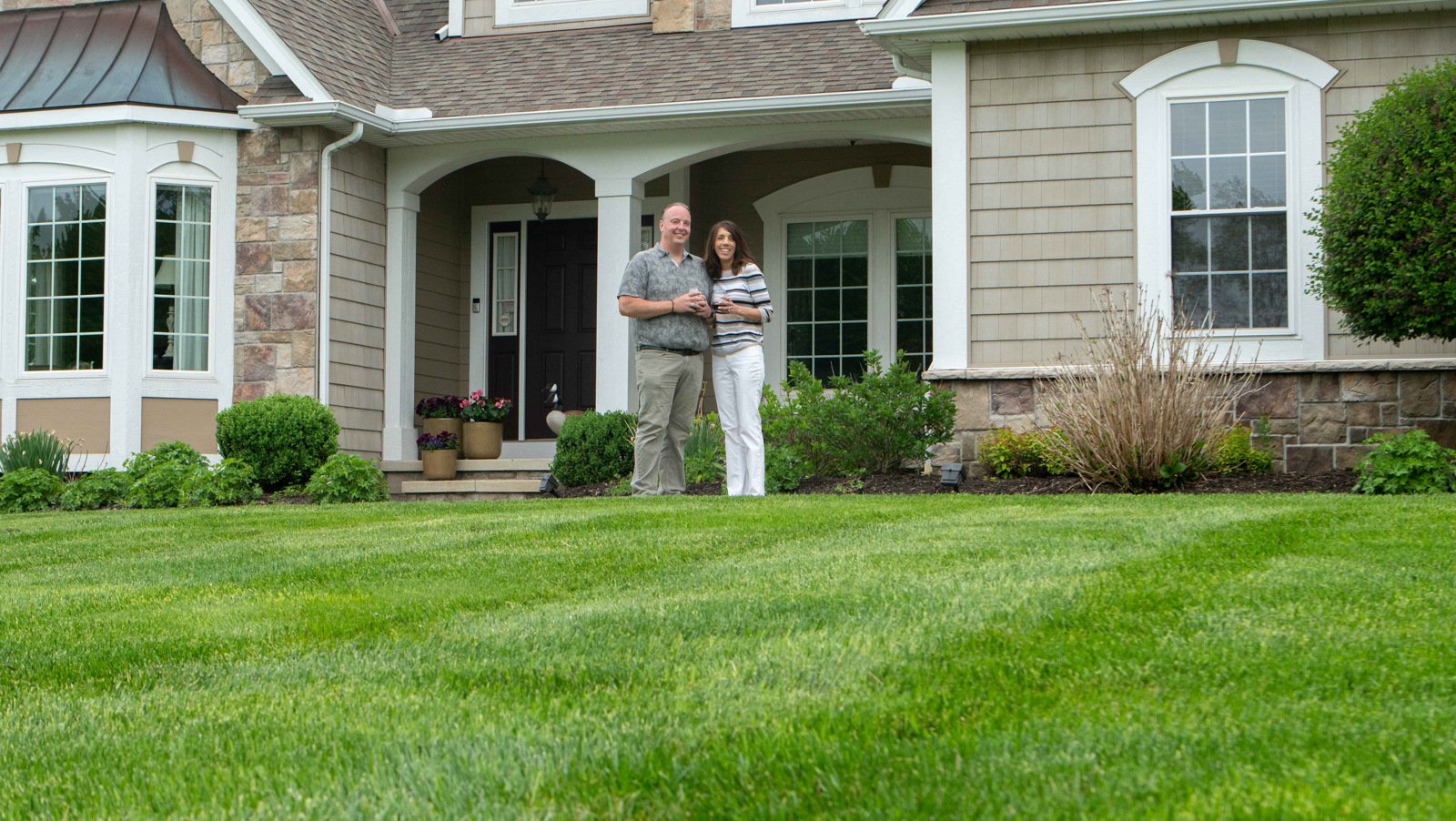 customers looking out at their mowed lawn