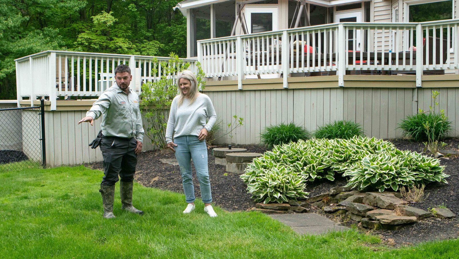 technician showing customer lawn 