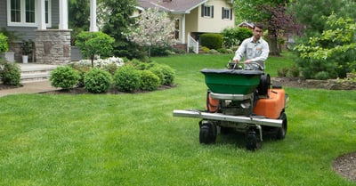 technician riding machine lawn care green grass