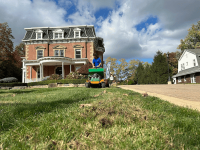 crew aerating lawn 