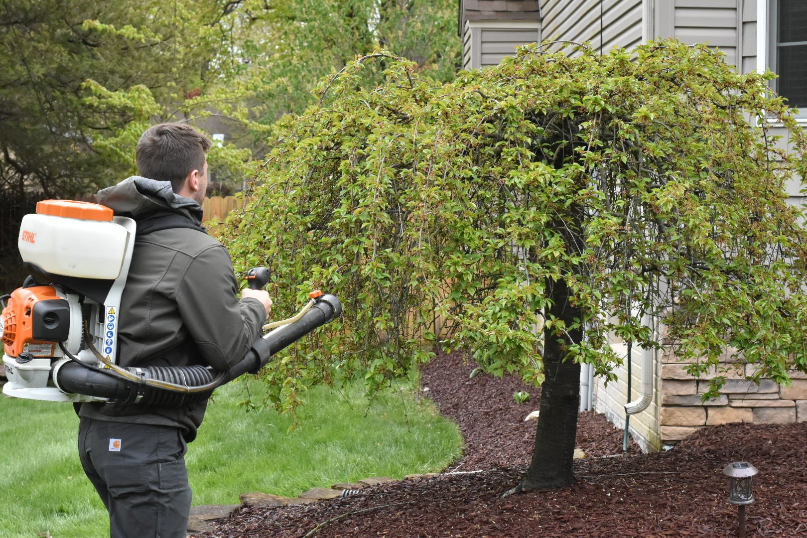 crew spraying for moquitoes around home