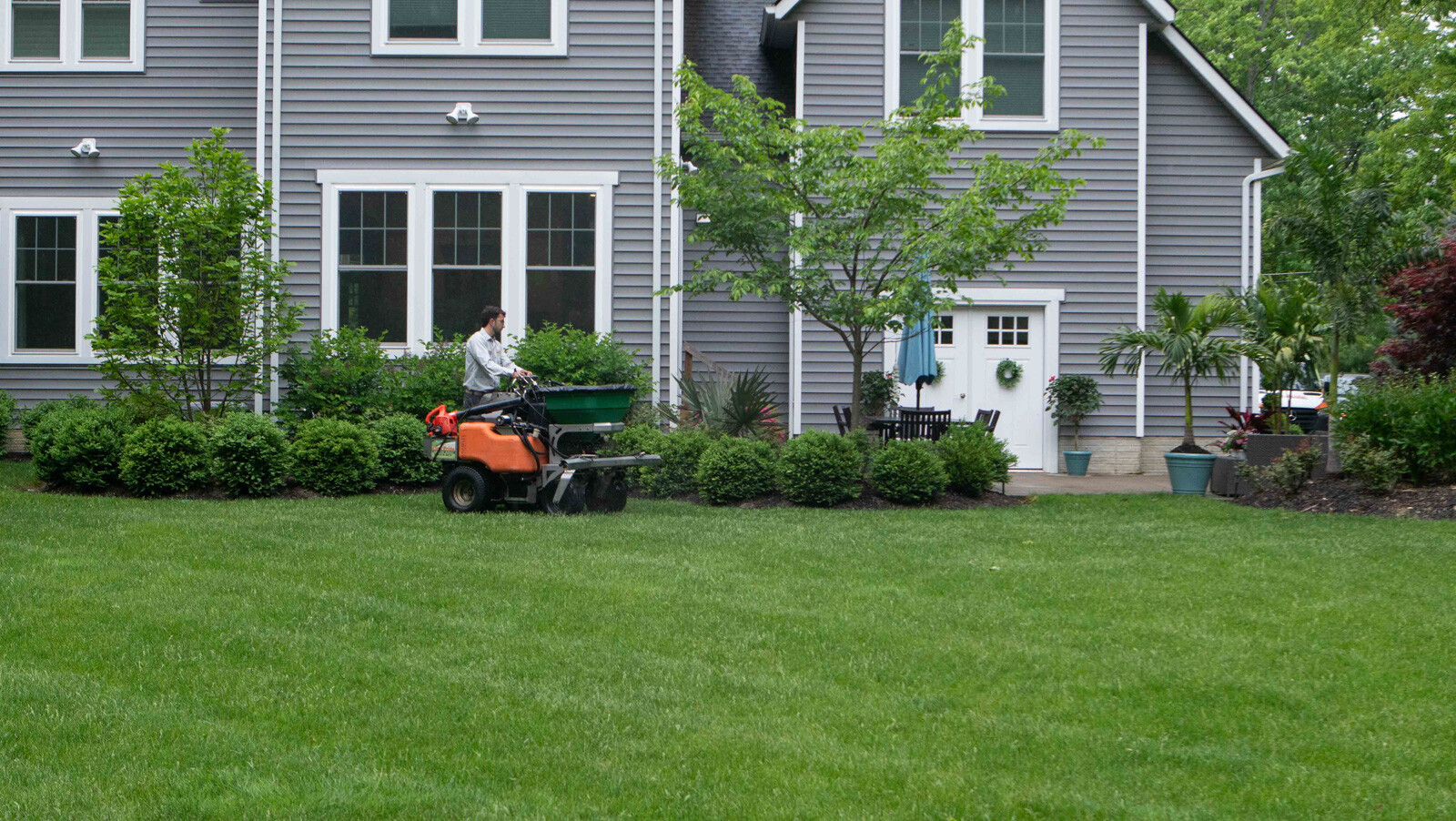 crew on lawn in customer backyard 