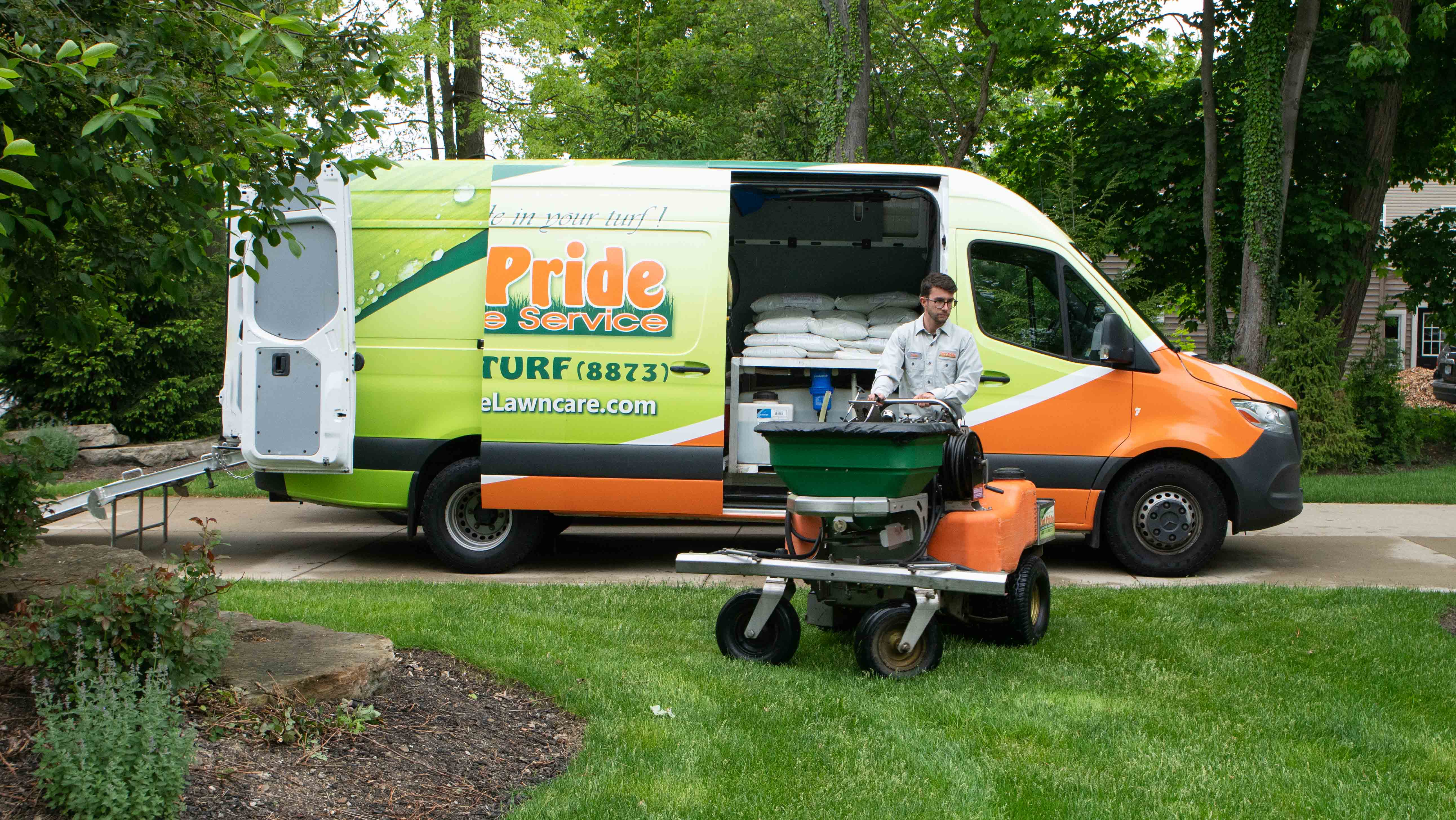 Lawn technician and Turf Pride van
